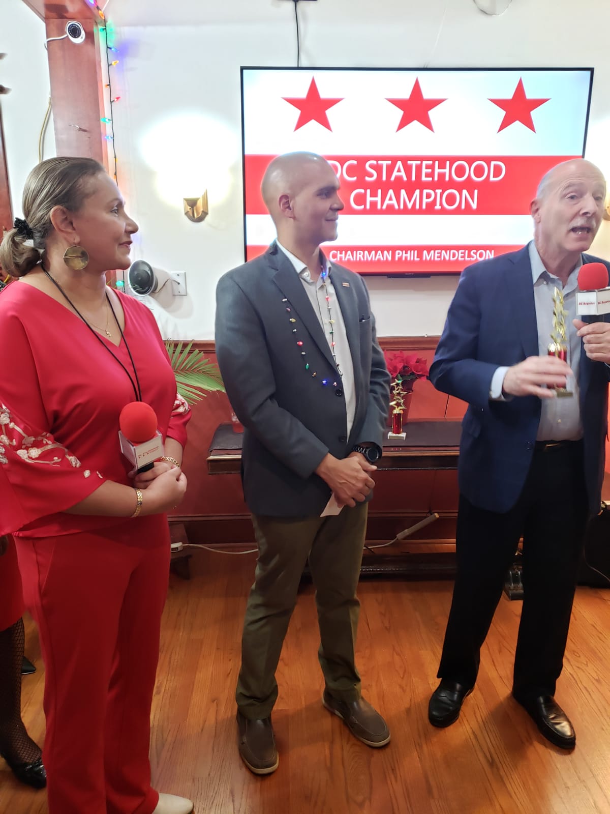 Franklin Garcia at his recent holiday celebration with DC Council Chairman Phil Mendelsohn and Silvia Martinez of the DNC.